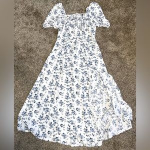 This is a long floral blue dress that has never been worn before.